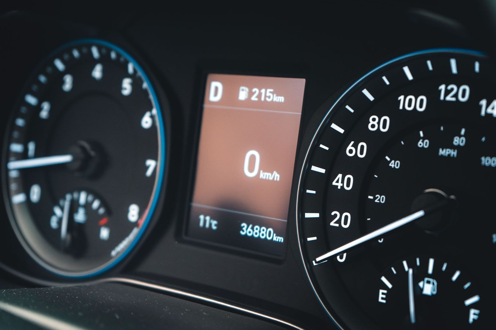 A fuel gauge and dashboard on a long highway drive