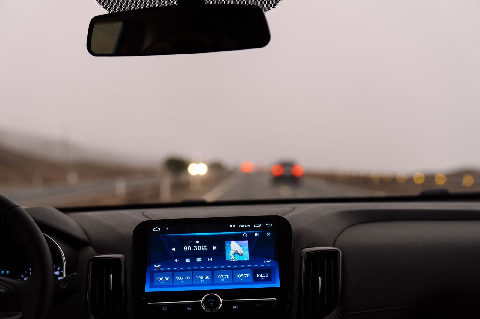 A tablet showing a fixed-price quote on a reservation engine beside car keys
